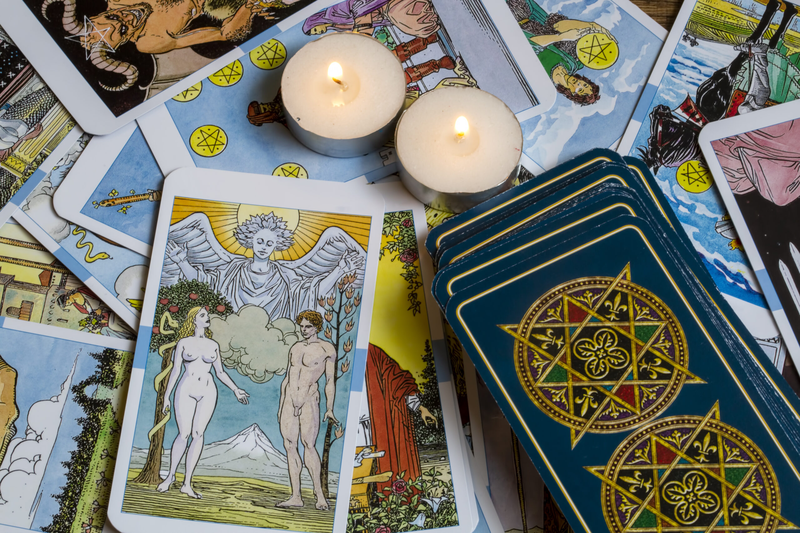 Assorted tarot cards scattered on a table, seamless pattern