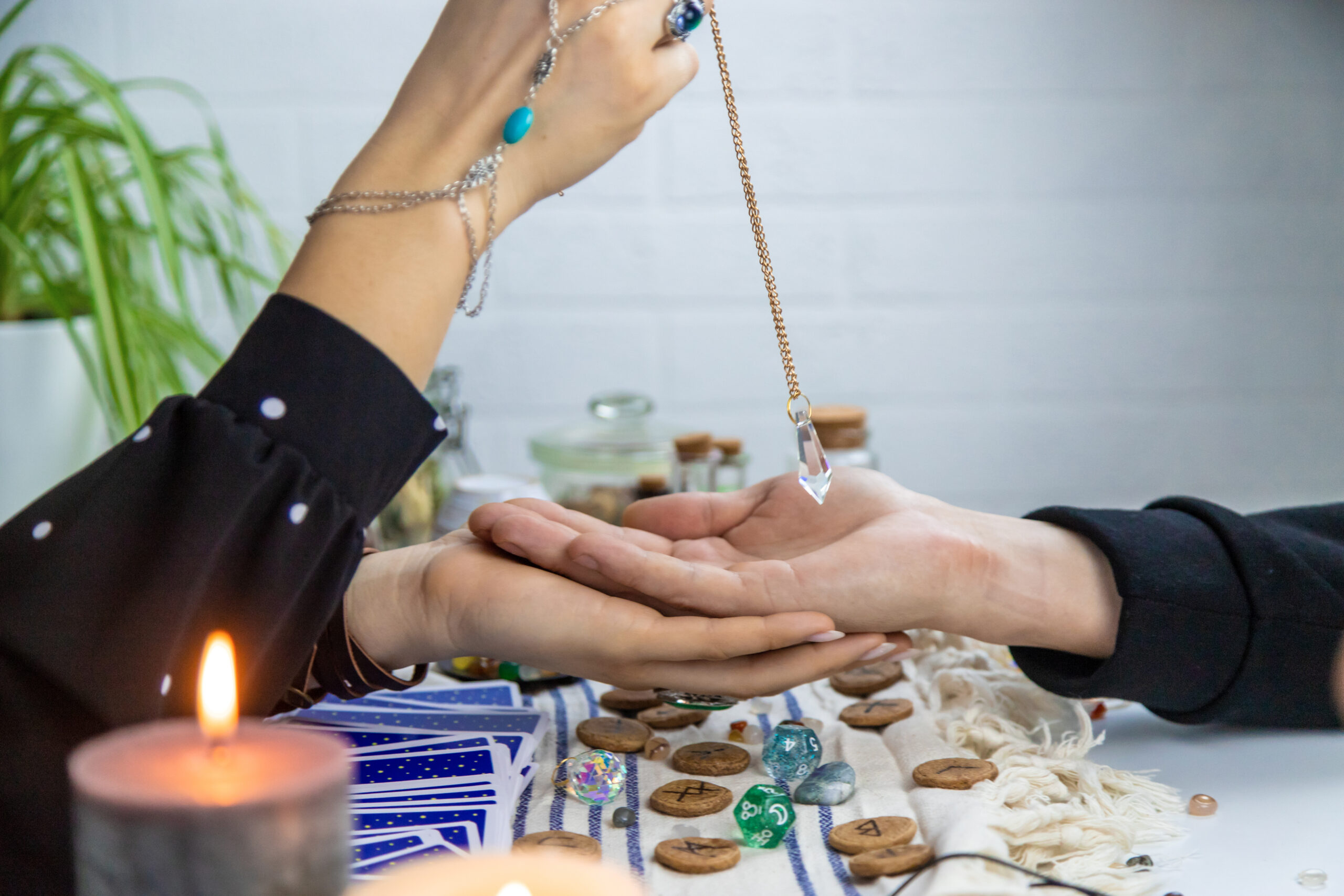A fortune teller reads with tarot cards. Selective focus. Woman.